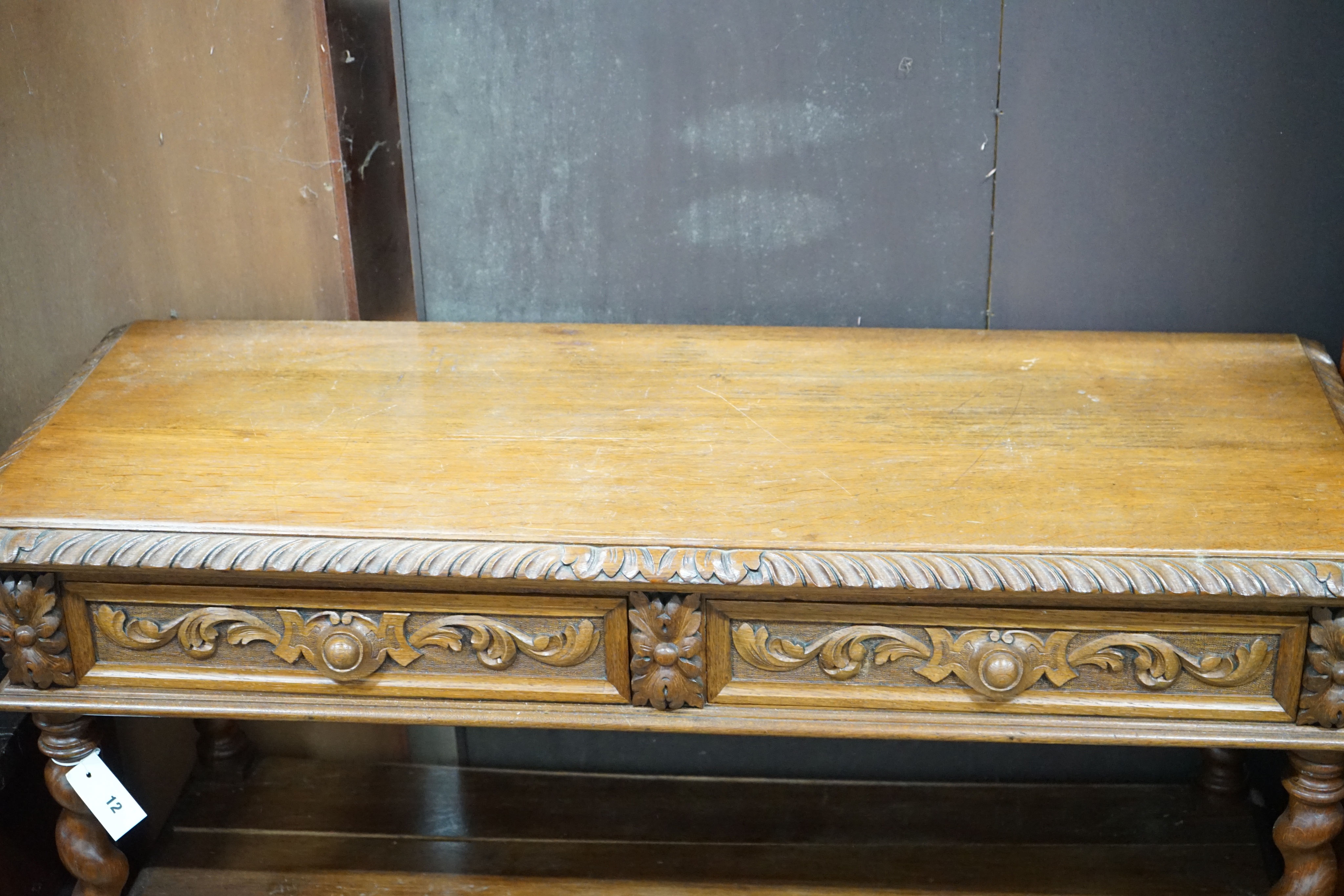 A late Victorian carved oak three tier buffet, width 115cm depth 44cm height 98cm